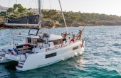 3_guests_on_board_lagoon_40_samana Superyachts For Sale and Charter 1uk.com - Lagoon 40 Samana | Luxury Family Catamaran Charter Sicily